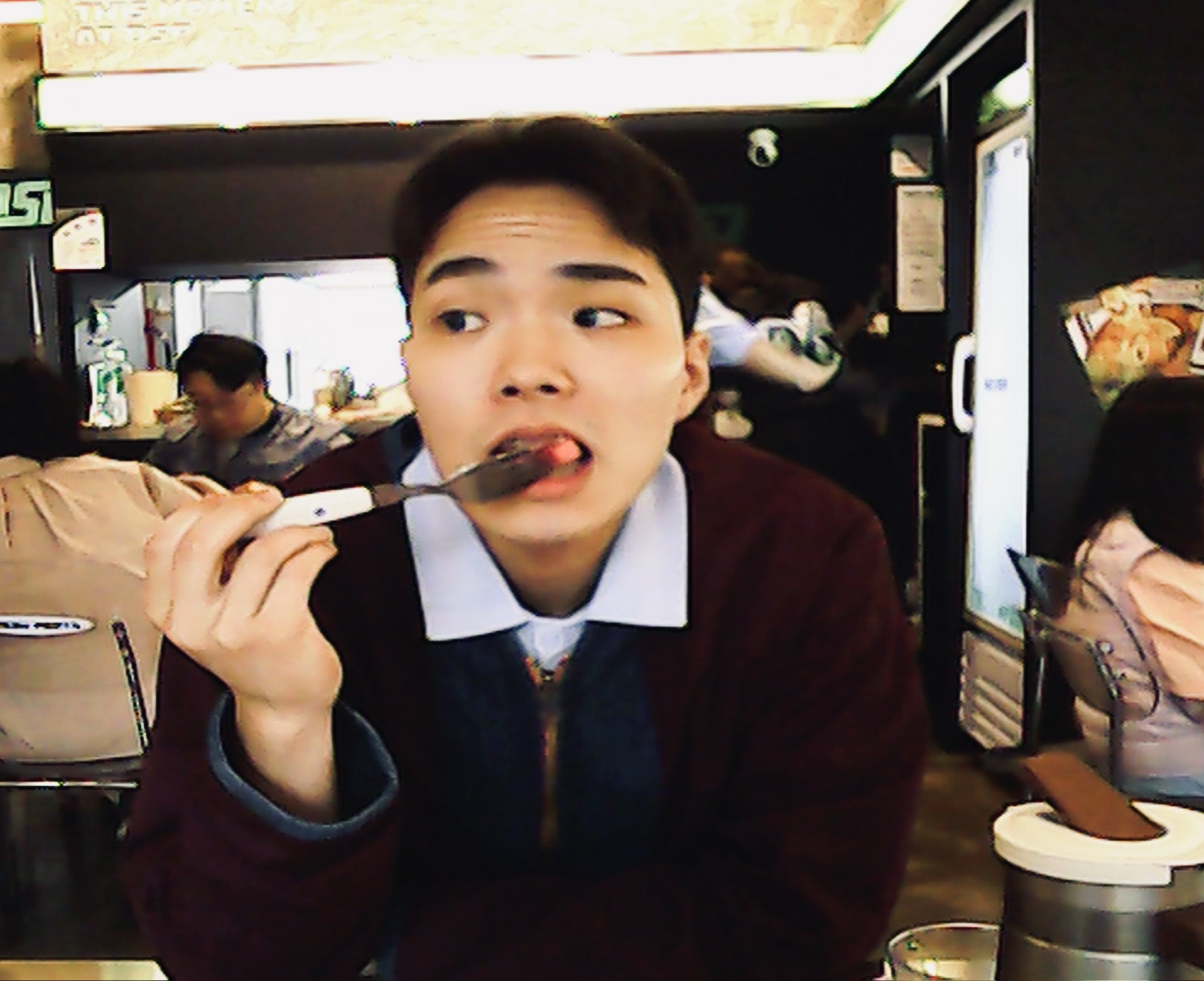 Yunho Choi enjoying a meal